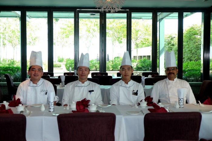Chinese Sous Chef H'ng Weng Kiang and his kitchen team