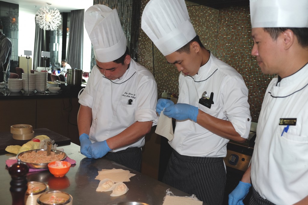 Chinese Sous Chef H'ng Weng Kiang and his kitchen team making deep-fried beancurd prawn roll
